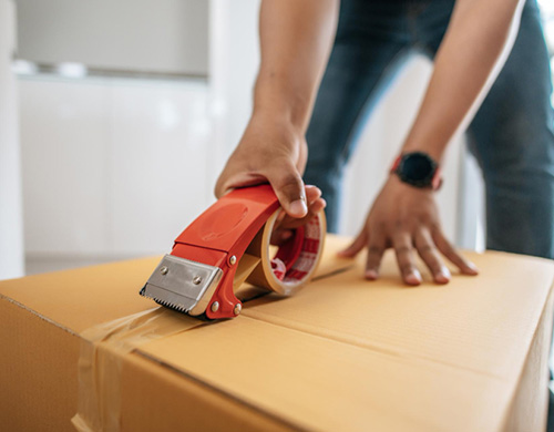 Close-up of box sealing by Logistic Union Inc for safe local and long-distance moving services